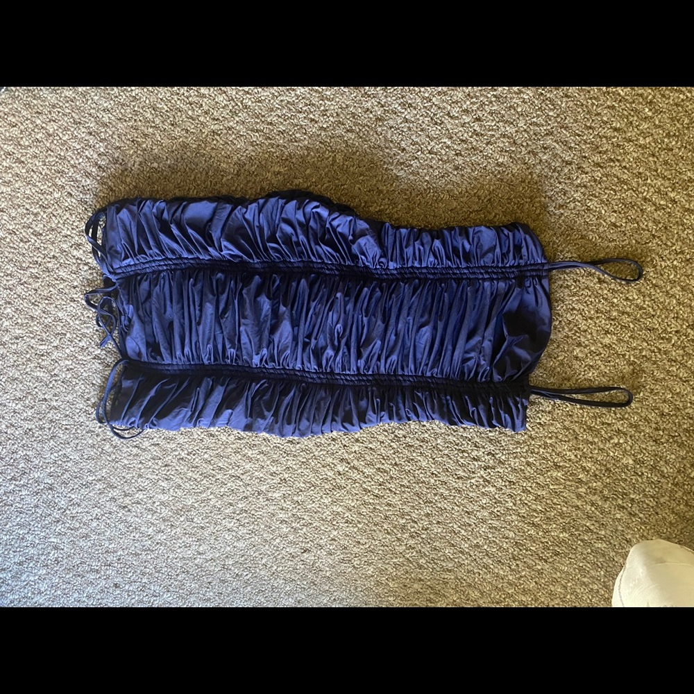 Rushed dress with ties on bottom